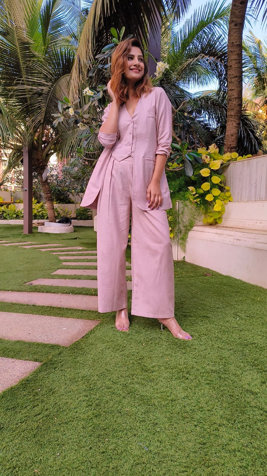 Bell-Bottoms Paired with a Sleek Halter Vest and Blazer