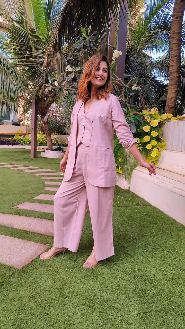 Bell-Bottoms Paired with a Sleek Halter Vest and Blazer